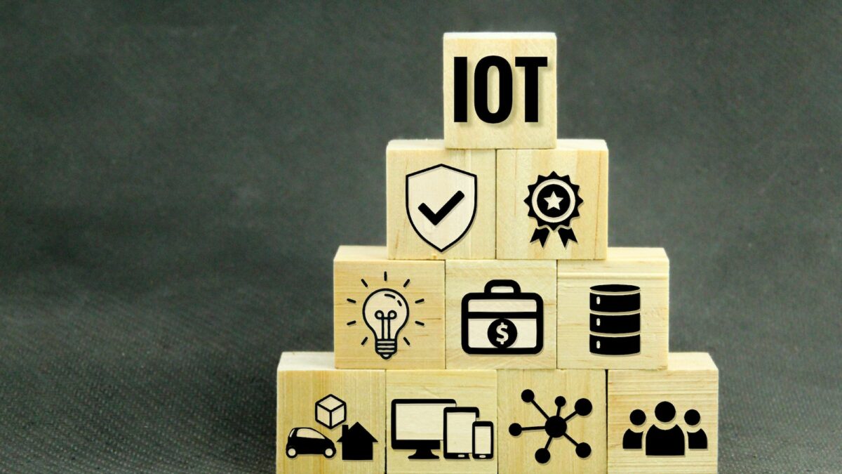 Internet of things or IoT concept letters with icons of end devices, objects, networks, standards