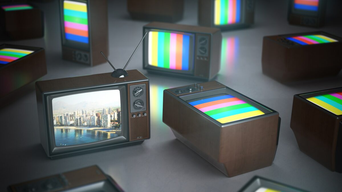 Pile of vintage TV with one in standby. TV channels concept