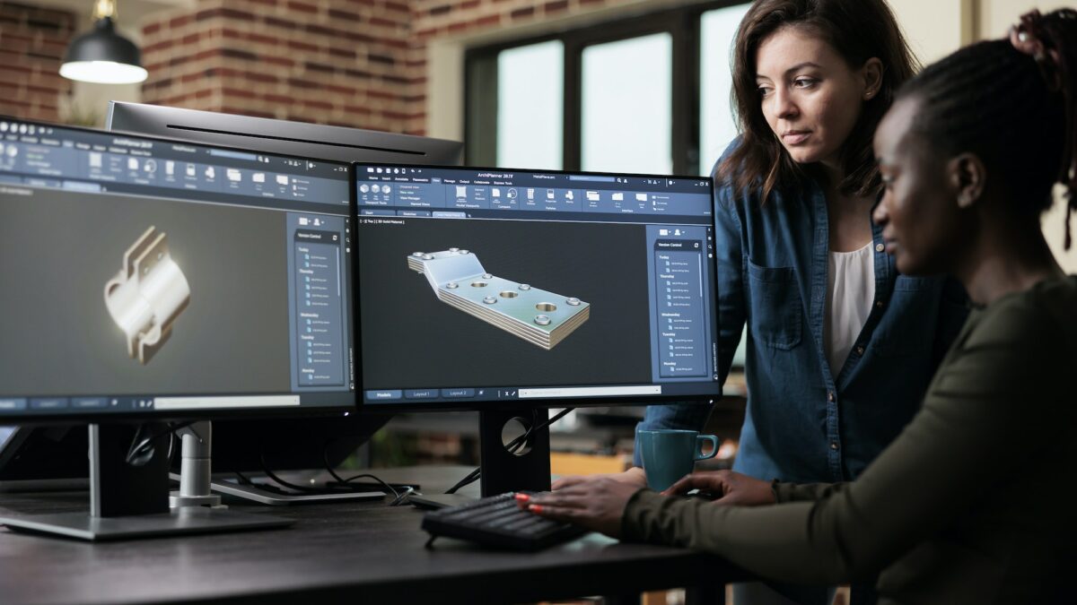 3D graphic artists sketching mechanical asset using advanced software technology.