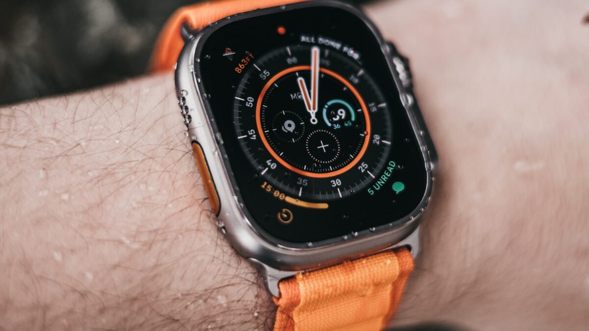 a close up of a person wearing an apple watch