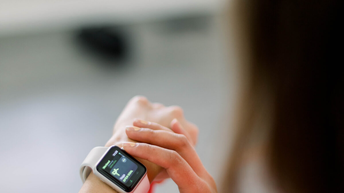 Woman checking her Apple Watch after a workout