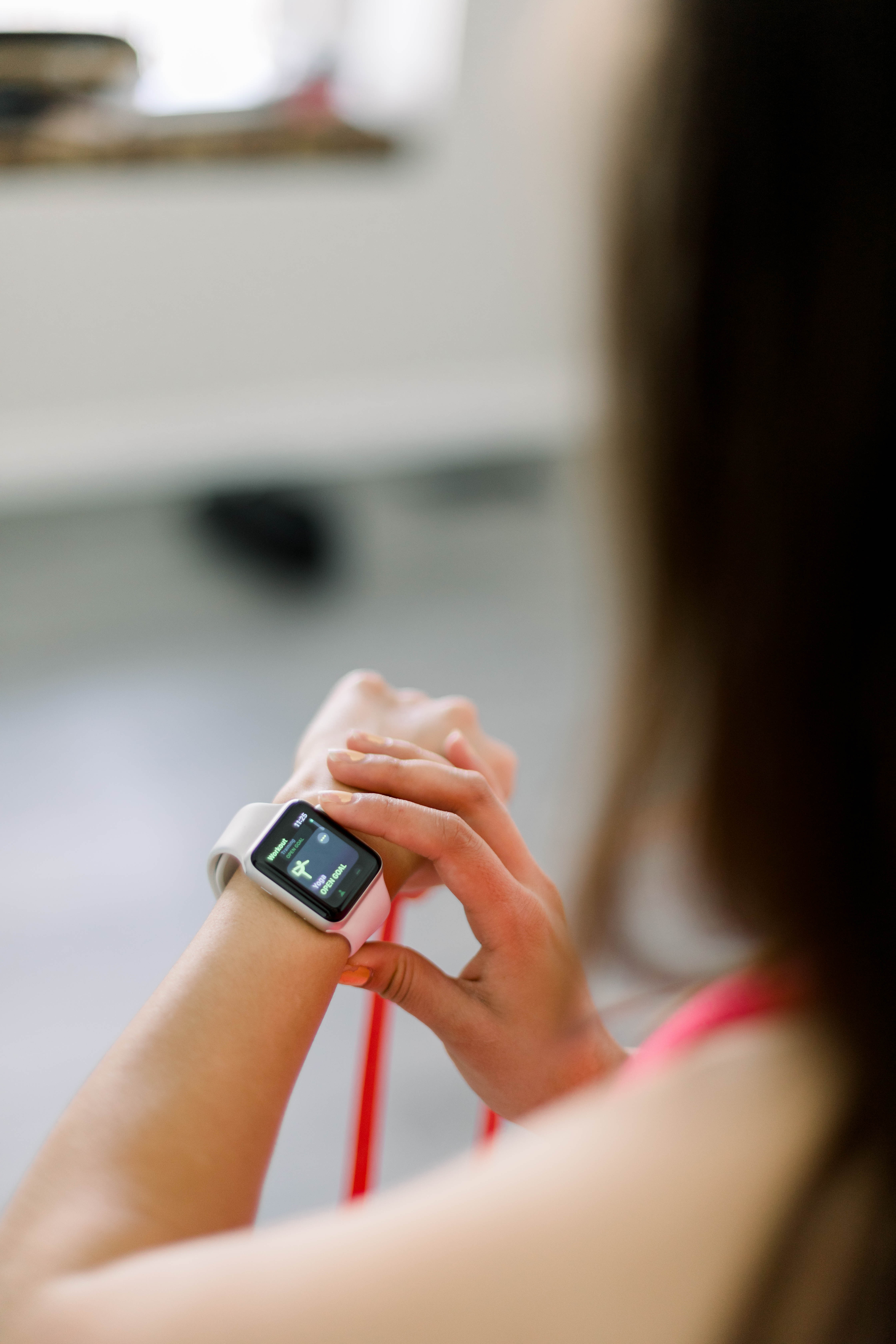 Woman checking her Apple Watch after a workout