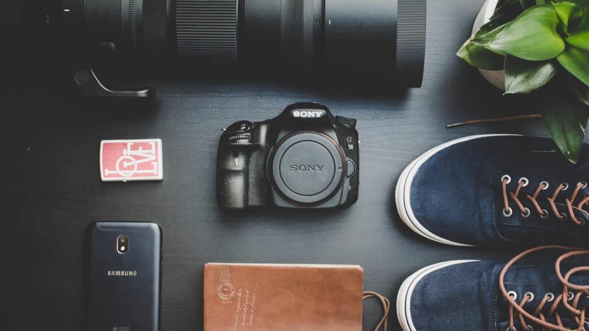 Top View Photo of Camera Near Shoes