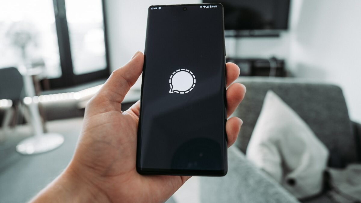 a hand holding a phone