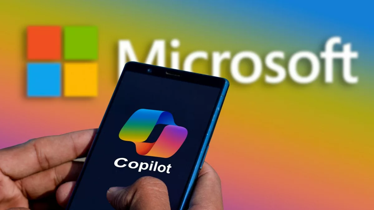 a person holding a cell phone in front of a microsoft copilot logo