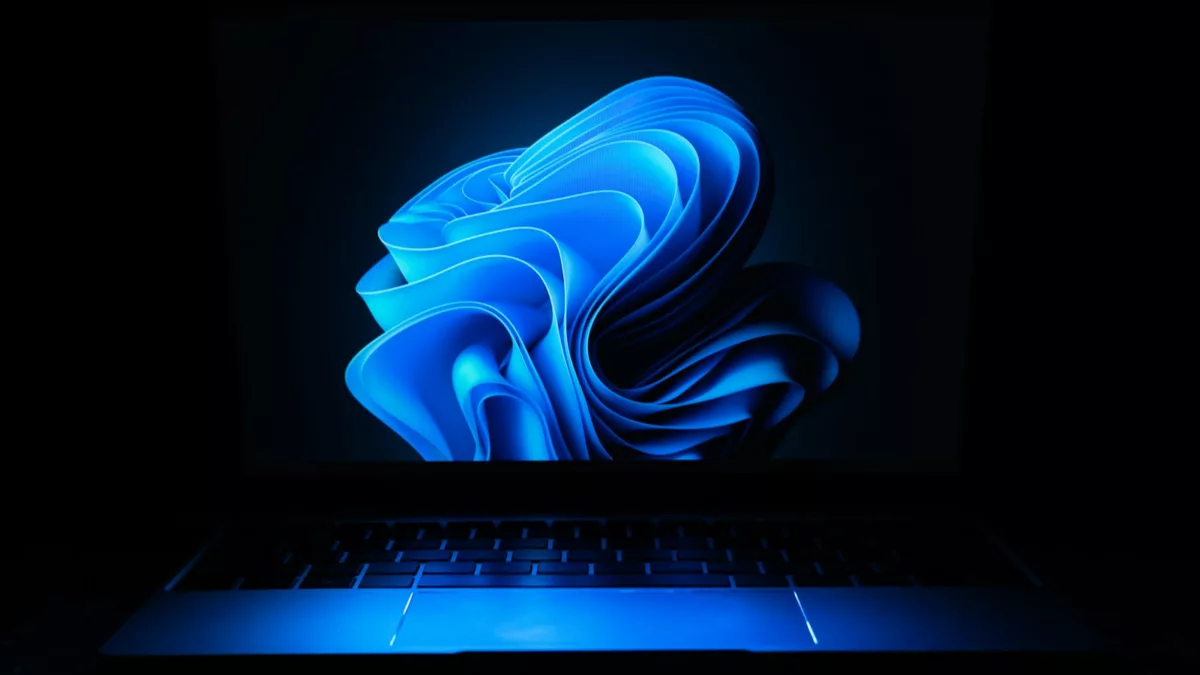 a macbook air laptop in the dark