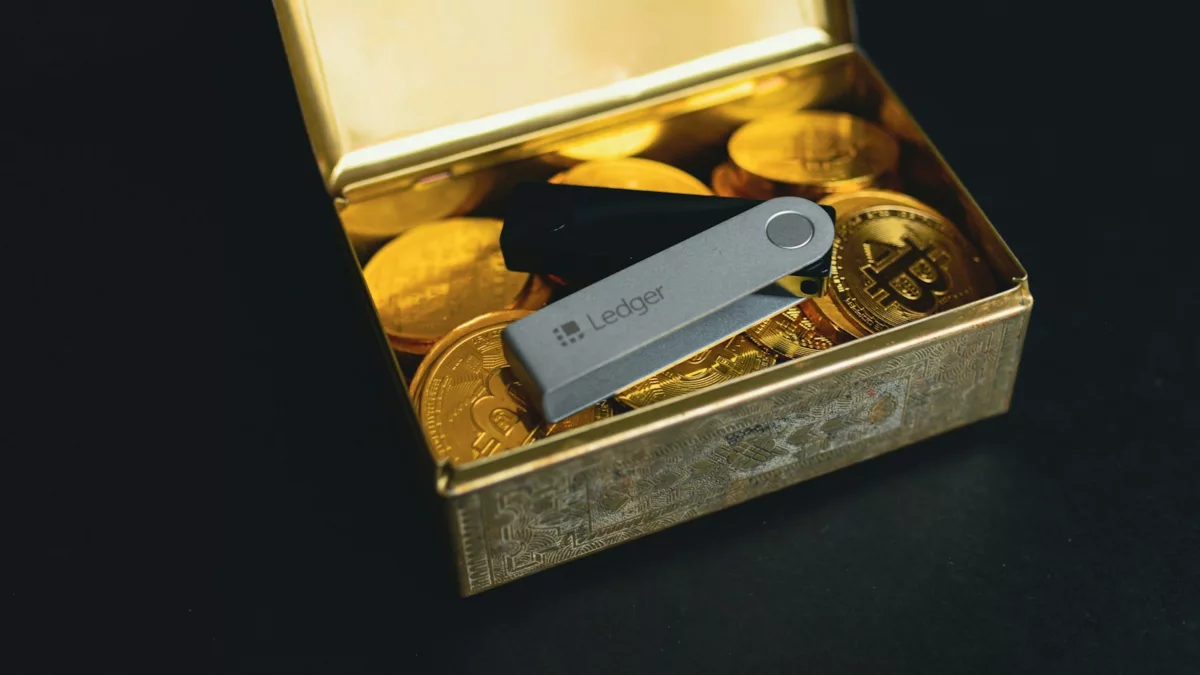 a swiss army knife sitting in a box of gold coins