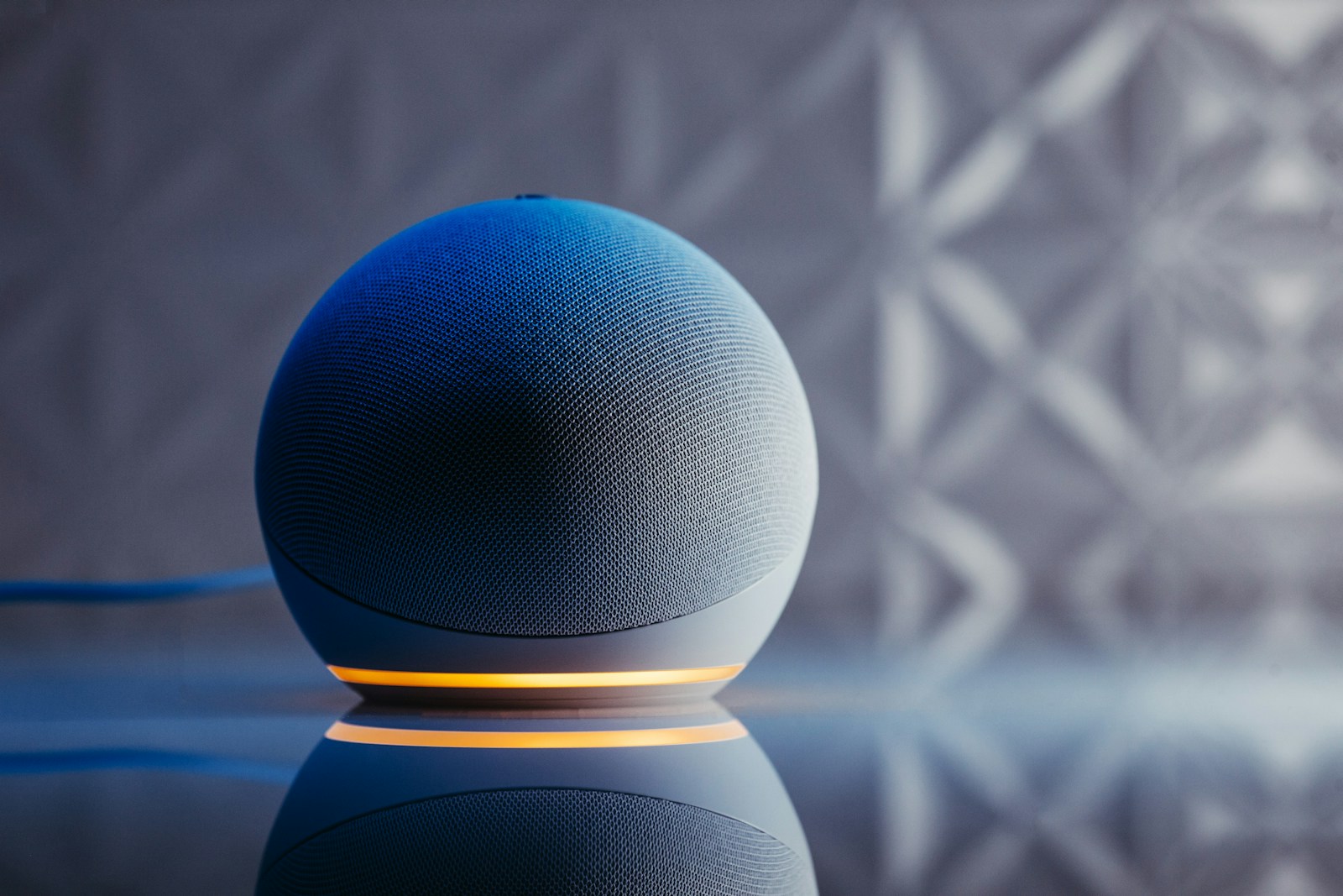 a blue ball on a black surface