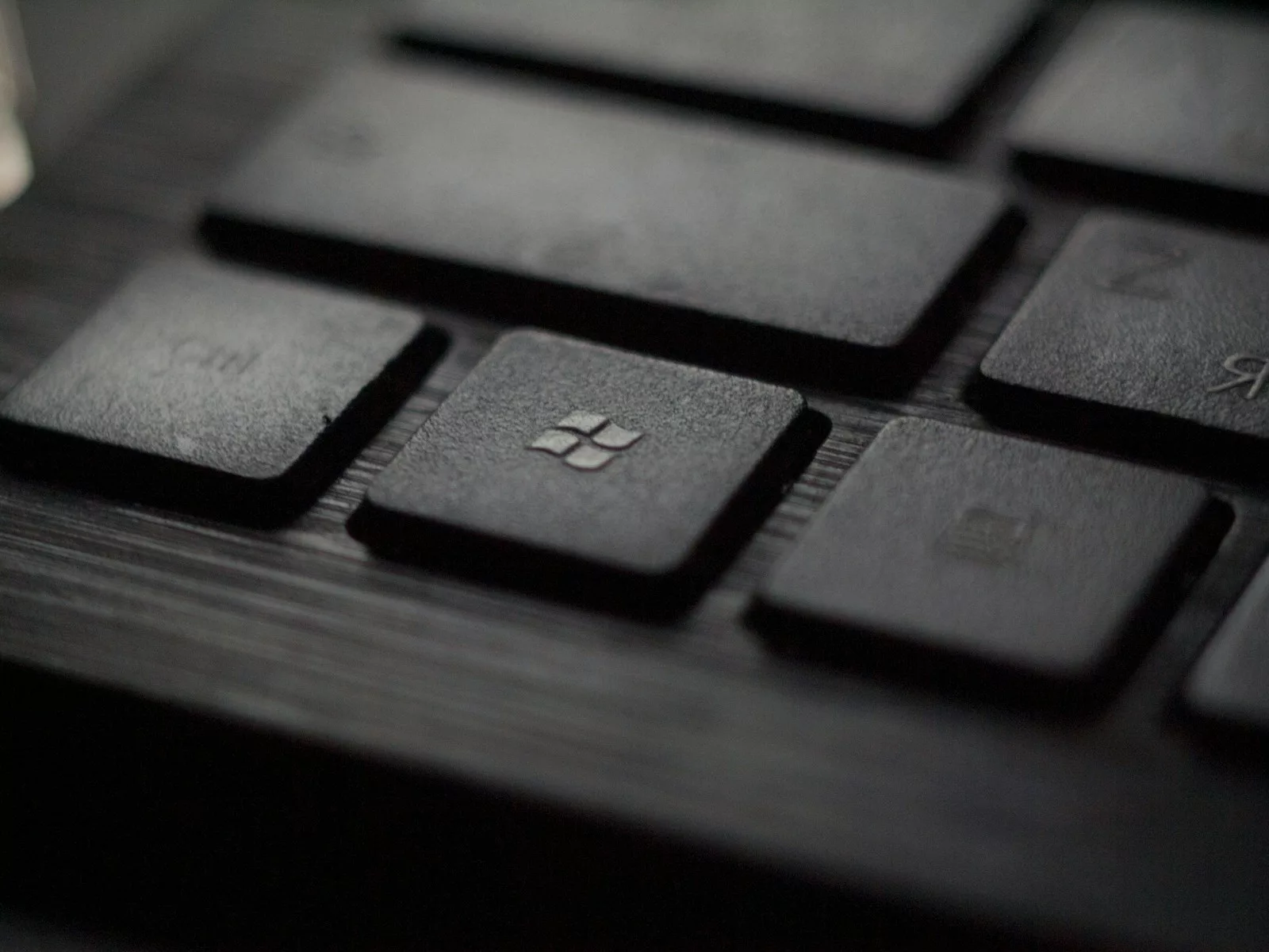 black laptop computer keyboard in closeup photo