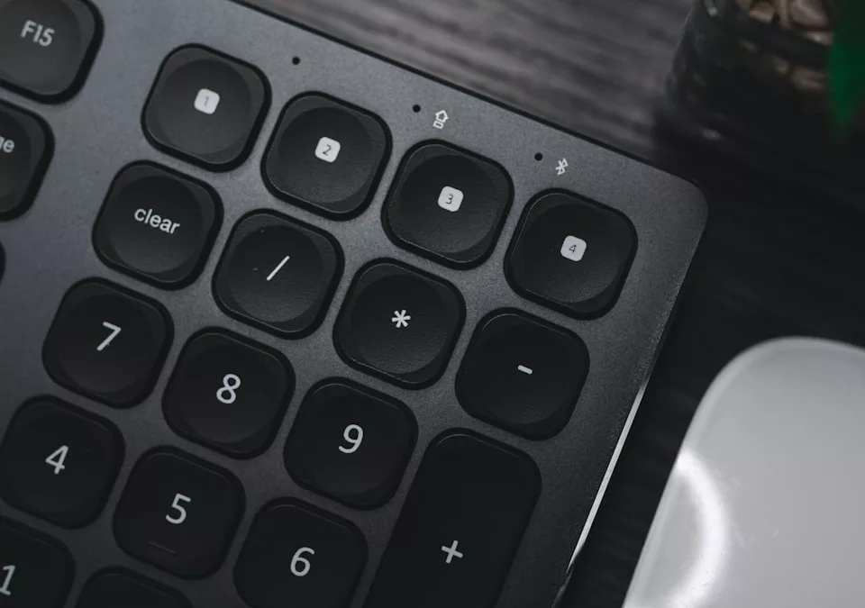 a close up of a keyboard and a mouse