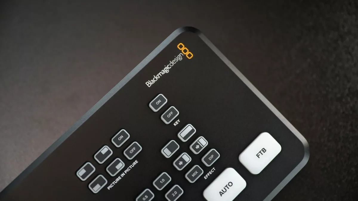 black remote control on brown wooden table